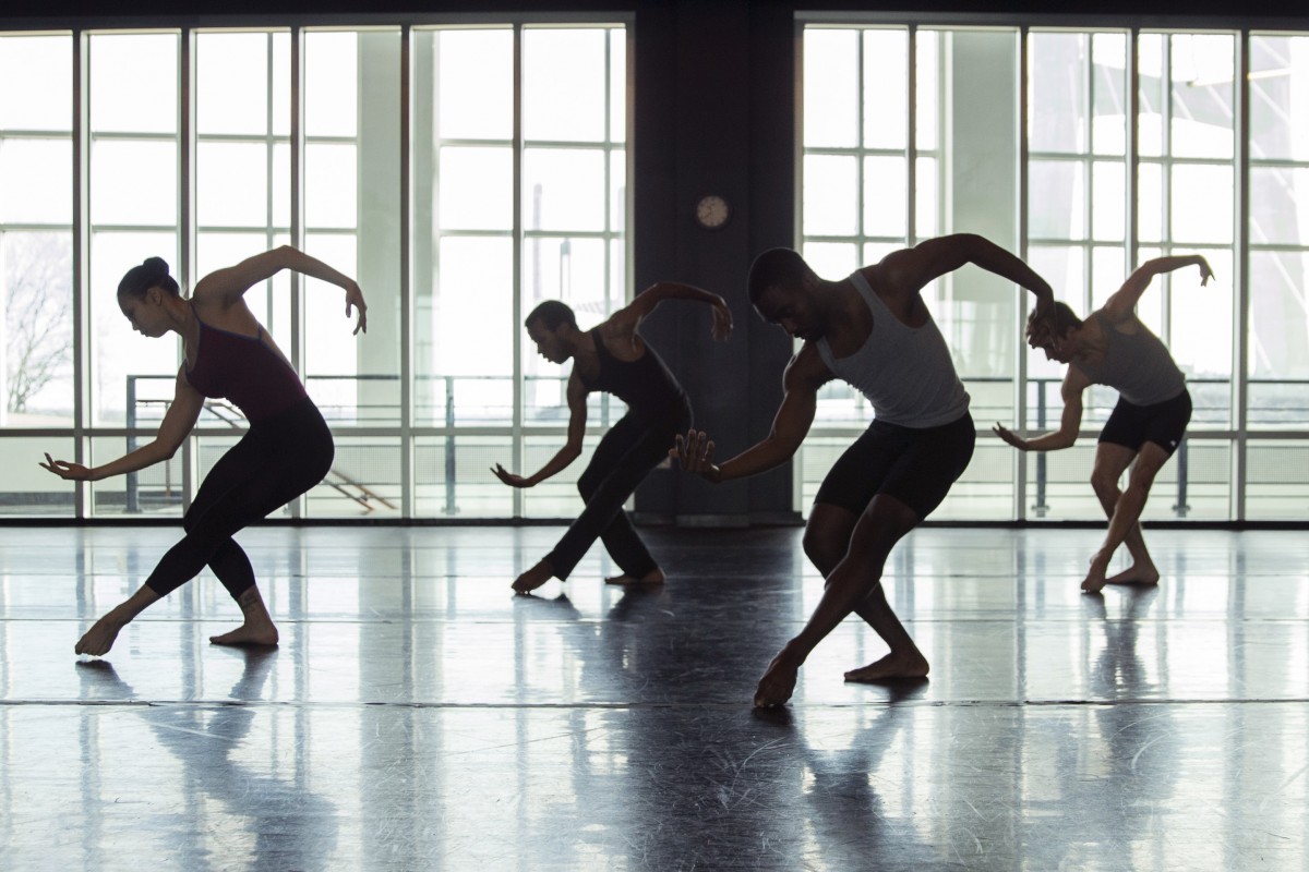 Dance students practicing technique in the studio