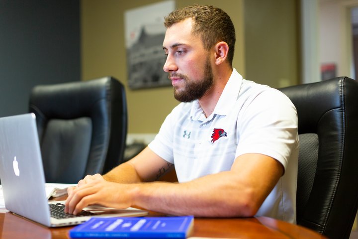 Man working diligently on homework