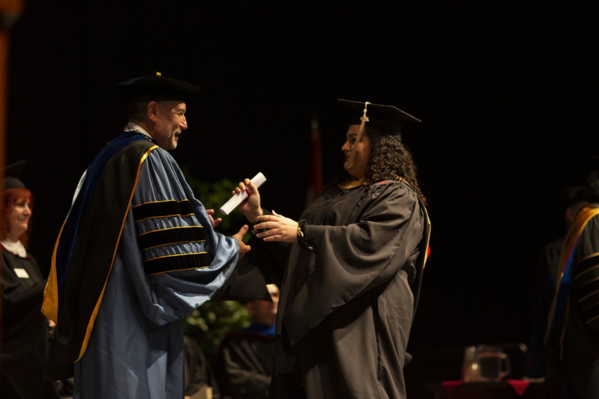 Two women talking together at a table