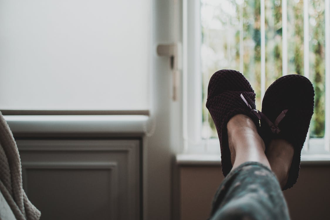 Person laying back with feet up