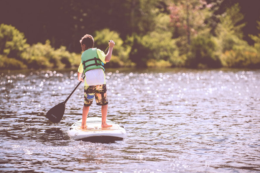 Person paddle boarding on a lake