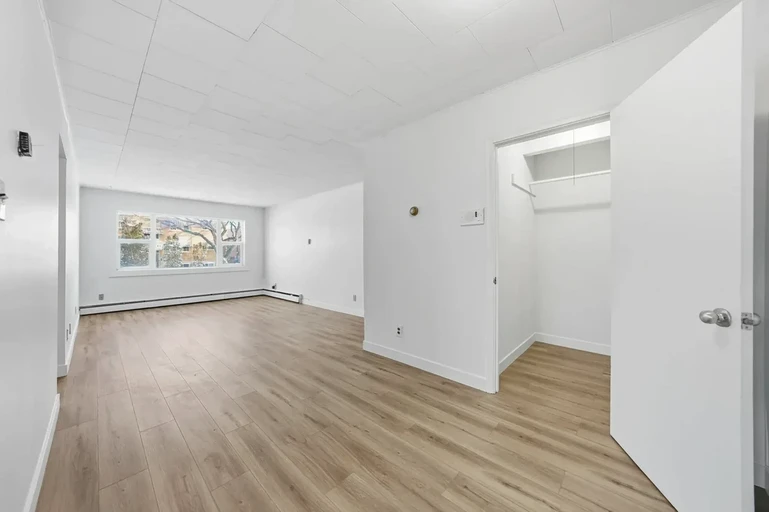 Large living room with open layout at Monterey Apartments in Regina.