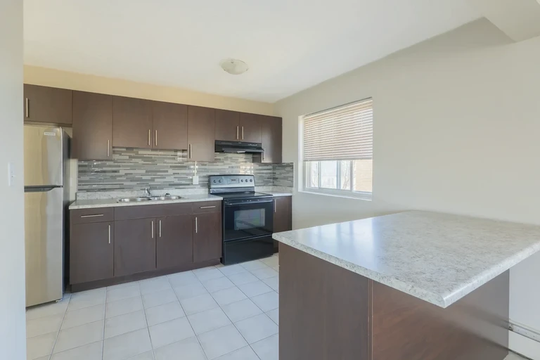Open-concept kitchen at Alex Manor in Edmonton.