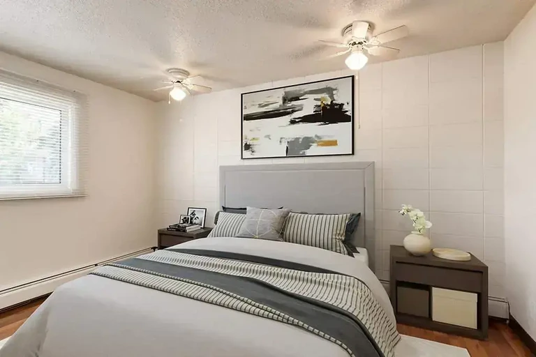 Comfortable size bedroom at Sandstone Manor in Calgary.