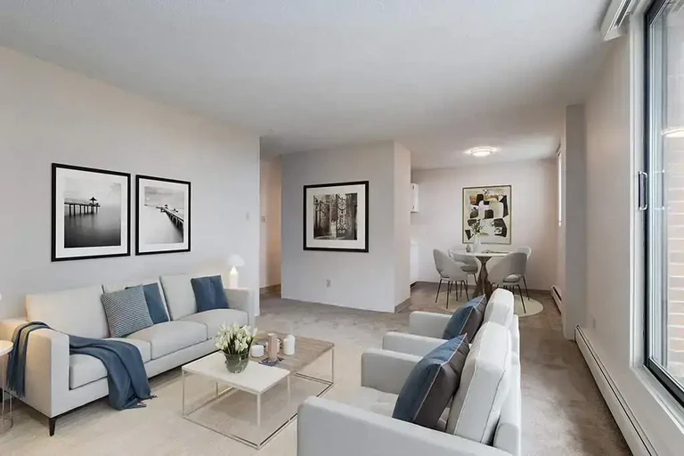 Airy living room with bright windows at Westside Apartments in Calgary.