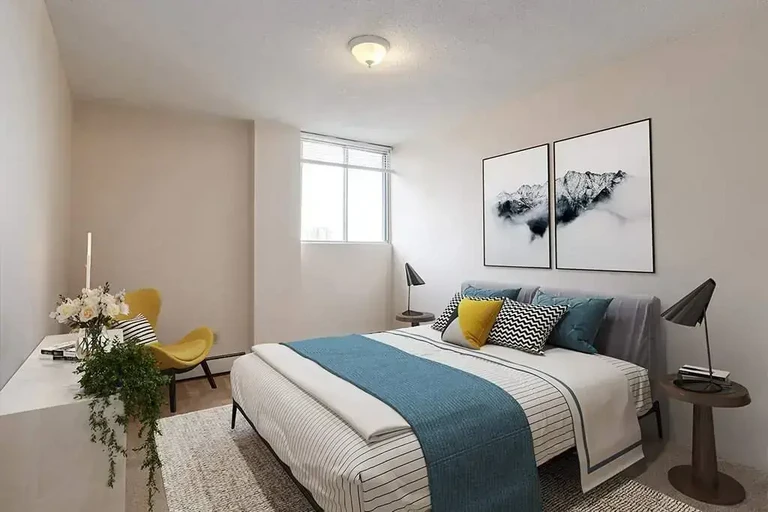 Comfortable and well-sized bedroom at Westside Apartments in Calgary.