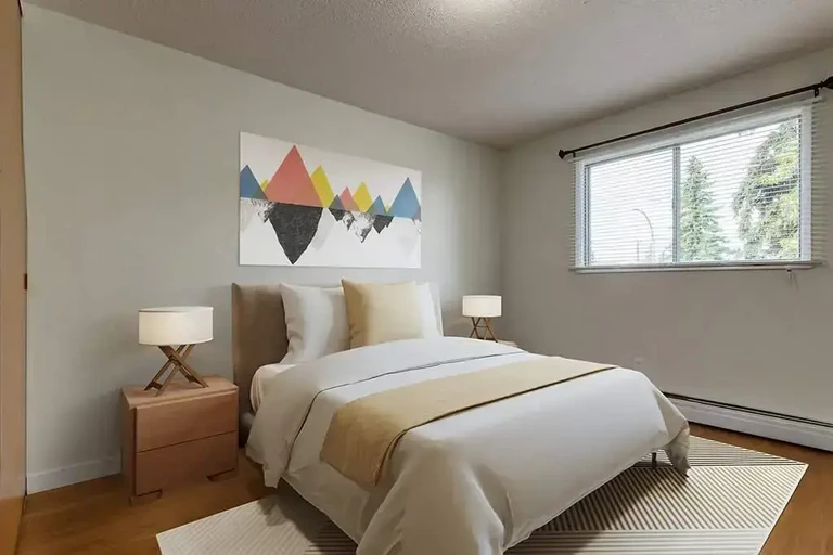 Comfortable size bedroom at Christopher's Place in Edmonton.