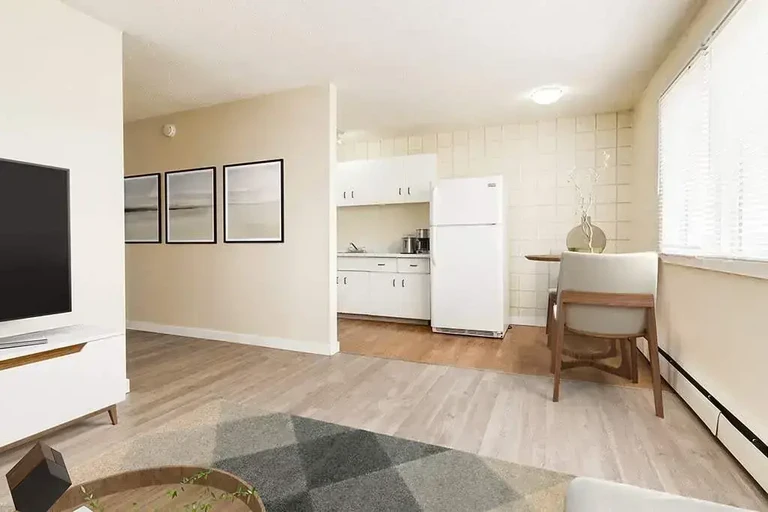 Open living room space, dining area and kitchen at Cloverdale Apartments in Edmonton.