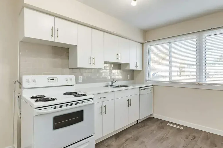 Bright open-concept kitchen area at Delton Townhomes in Edmonton.