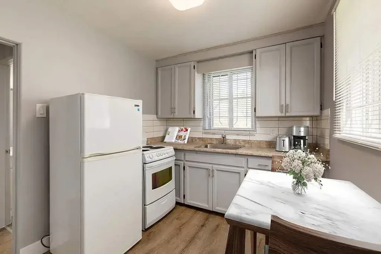 Cozy kitchen with dining area at Eastwood Apartments in Edmonton.