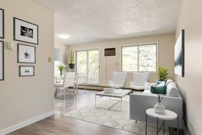 Bright living room with large windows at Casa Linda in Medicine Hat.