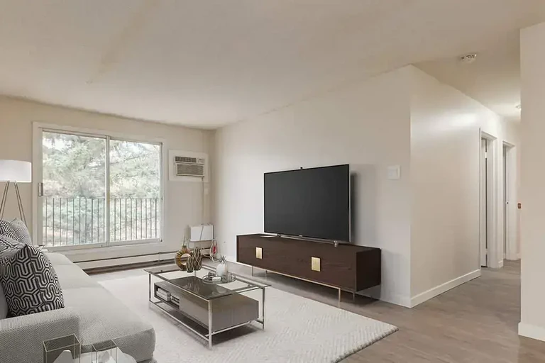 Bright living room with natural light at Woodlily Court in Moose Jaw.
