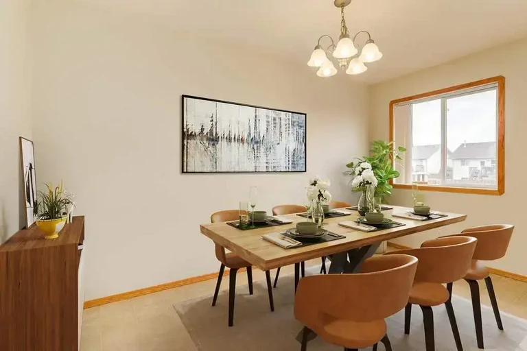 Dining area with natural light at Kitson Close Townhomes in Red Deer.