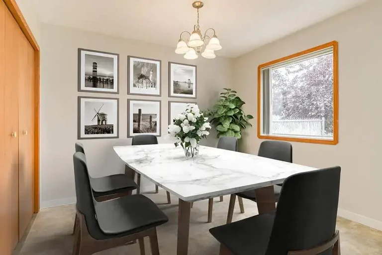 Dining area with natural light at Kyte Crescent Townhomes in Red Deer.