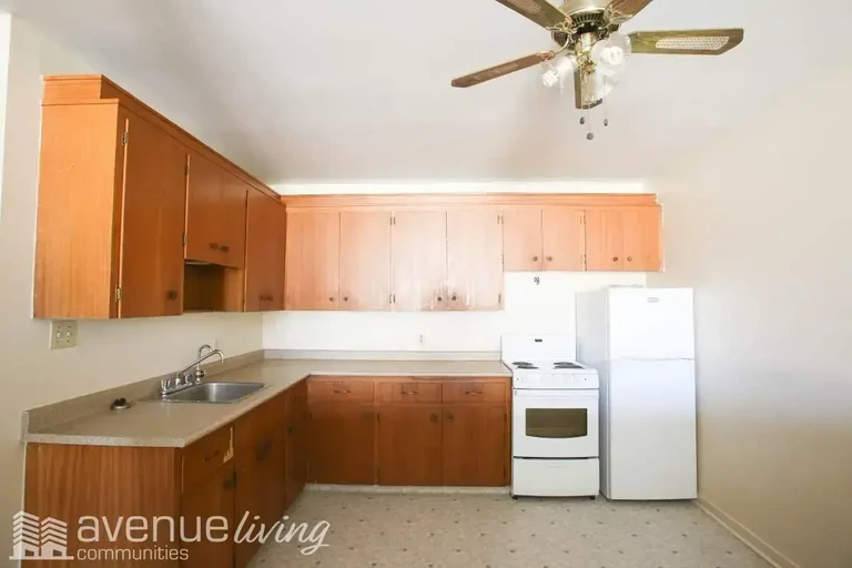 Open-concept kitchen at  Angus Place in Regina.