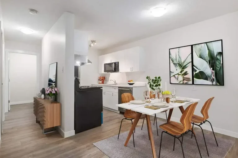 Galley kitchen and dining area at Arbor Green in Saskatoon.