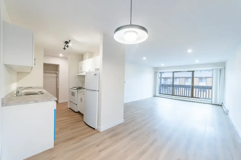 Open kitchen design connected to living space at Applewood Village in Calgary.