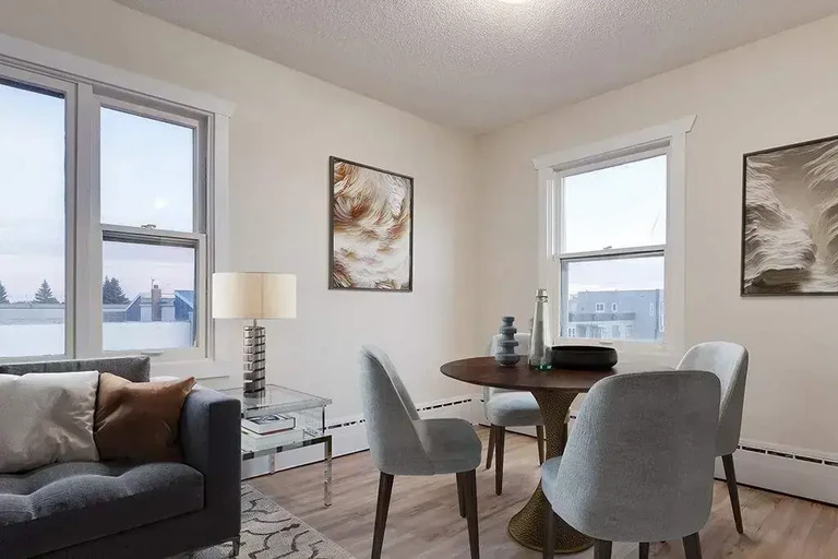 Open concept living room and dining area at Belvedere Apartments in Wetaskiwin.