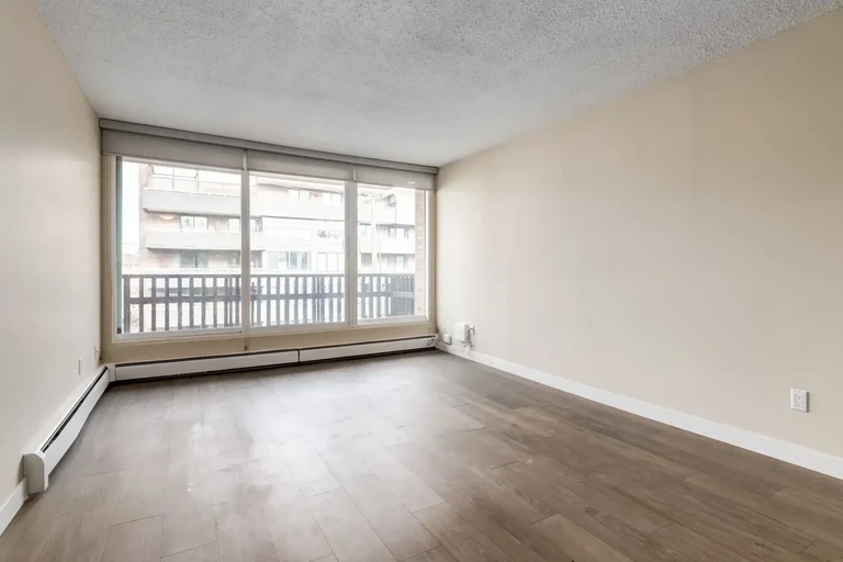 Bright living room with natural light at Chinook Gardens in Calgary.