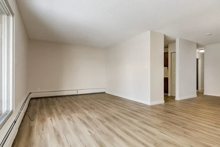 Large living room with open layout at Grand Park Village in Camrose.