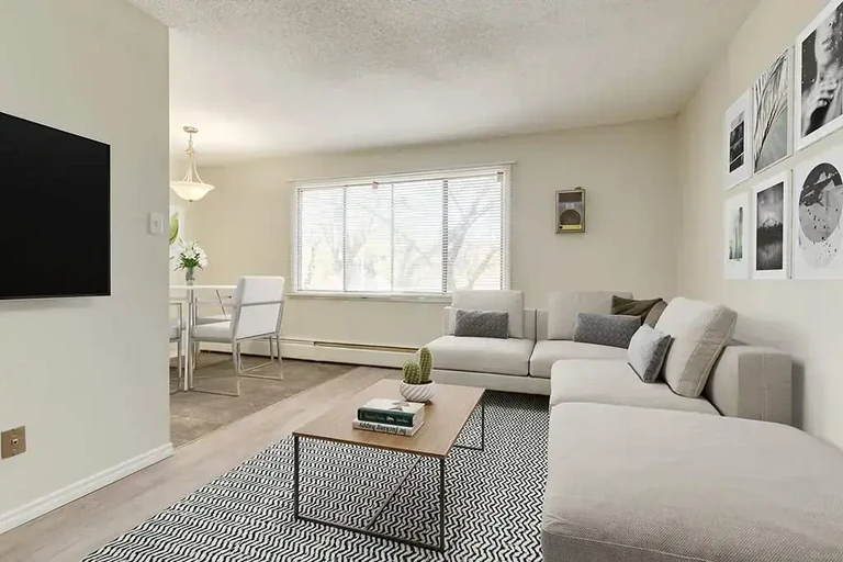 Large living room with open layout at Nine and Five Apartments in Edmonton.