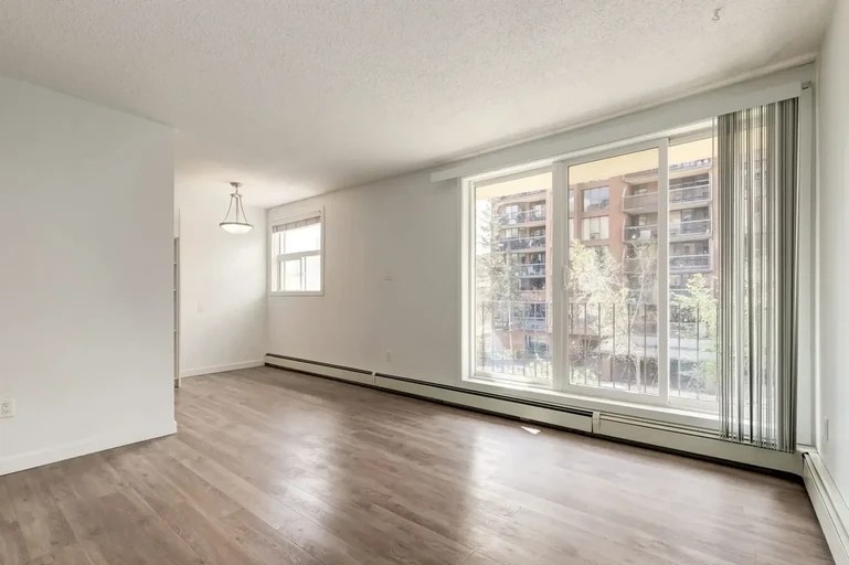 Bright living room with natural light at The Winston in Calgary. 
