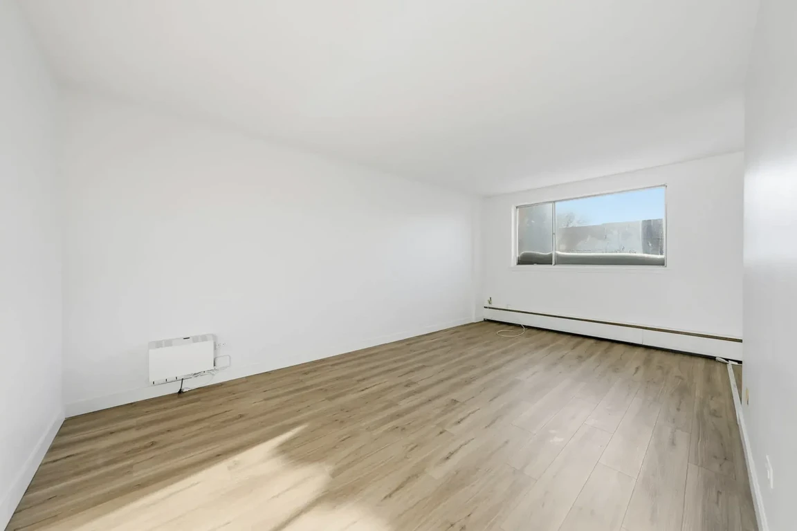 Generous living room area at Lord Robinson Apartments in Regina.