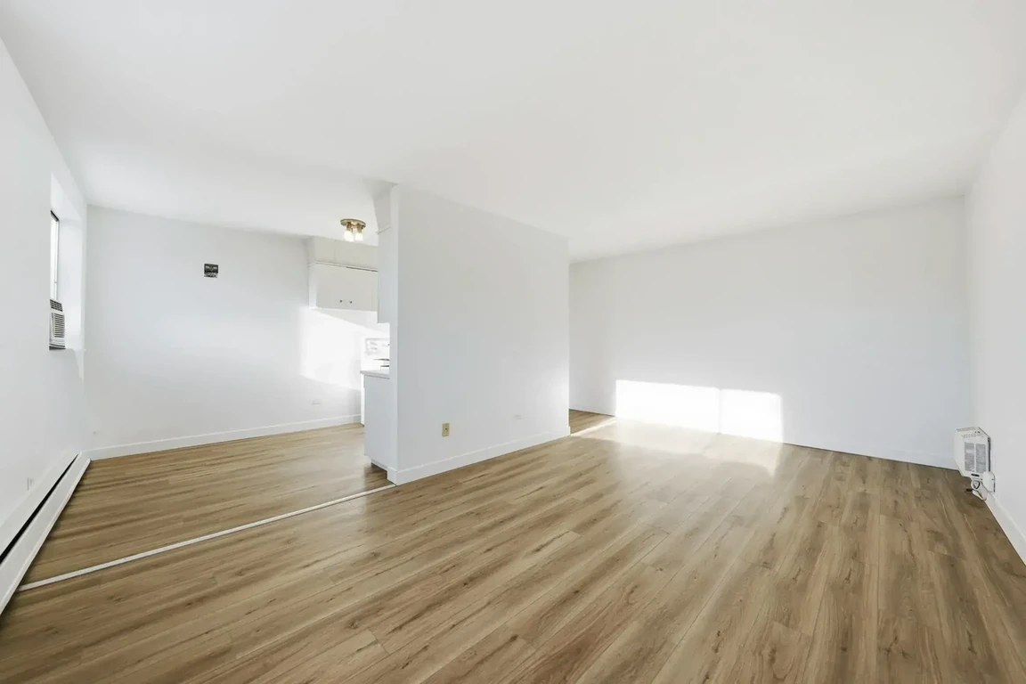 Bright living room with natural light at Lord Robinson Apartments in Regina.