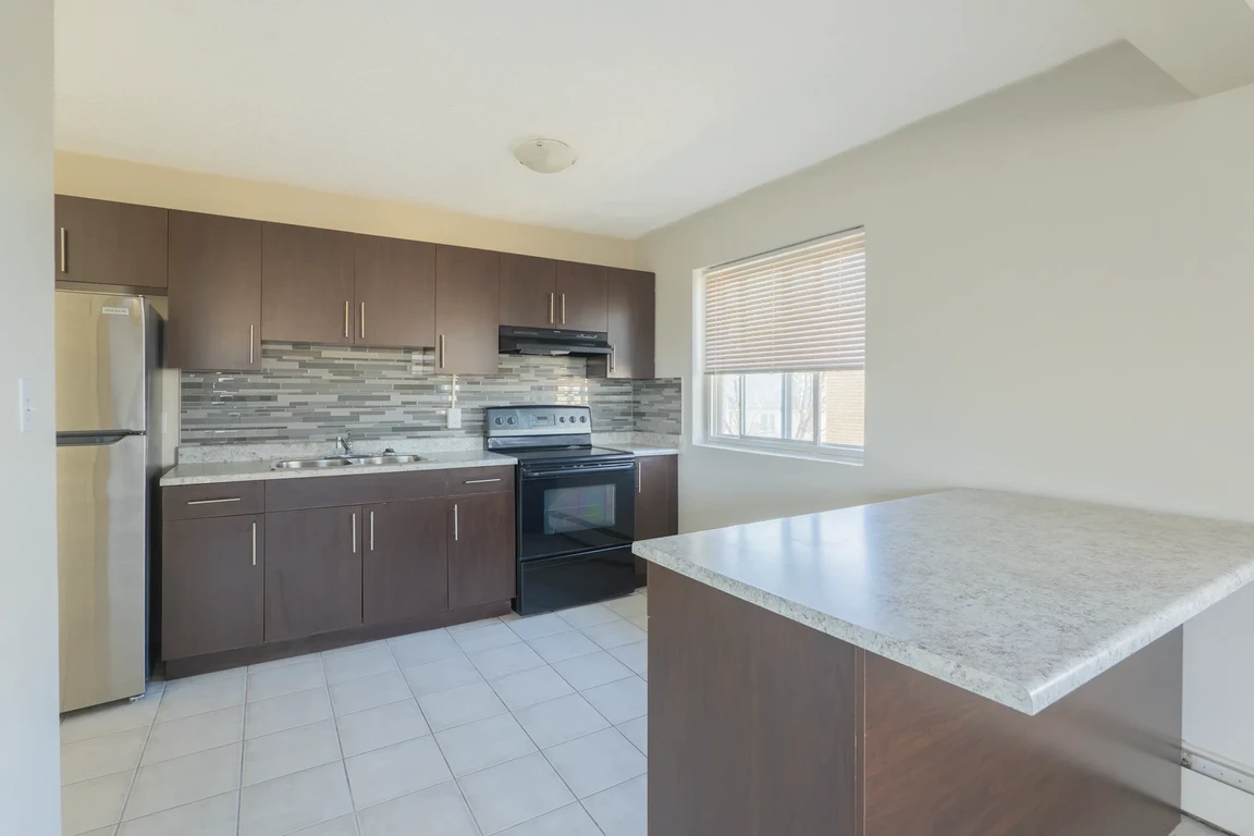 Open-concept kitchen at Alex Manor in Edmonton.