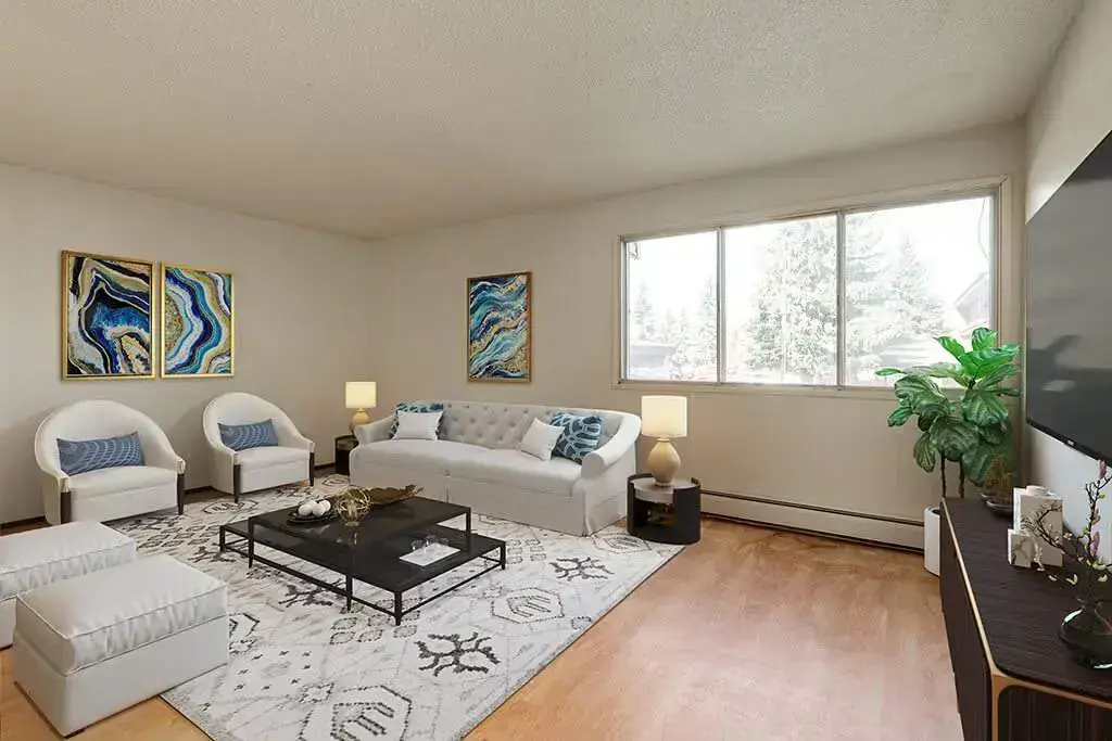 Bright living room with large windows at Central Apartments in Brooks.