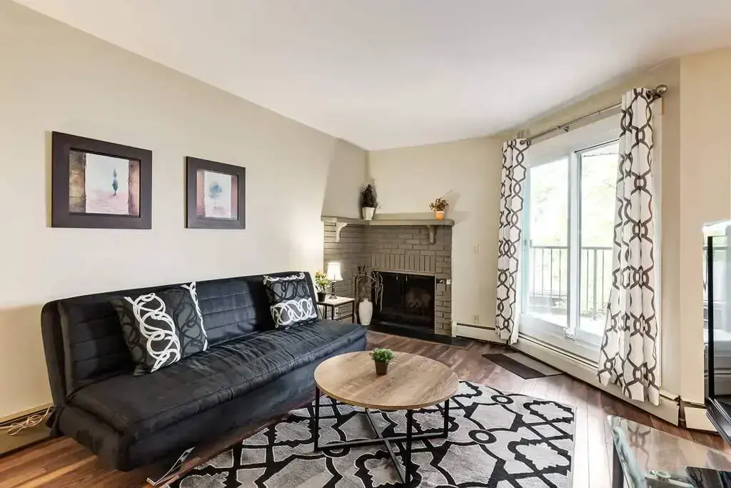 Comfortable living room with a fireplace at Bankview Vista in Calgary.
