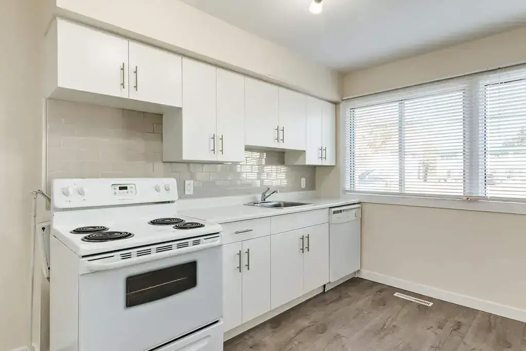 Bright open-concept kitchen area at Delton Townhomes in Edmonton.