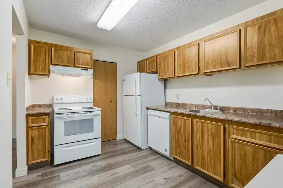 Bright open-concept kitchen area at Huntington Hill Coach Homes in Edmonton.