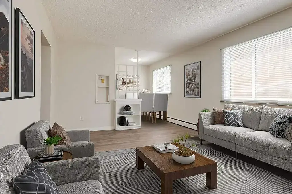 Airy living room with bright windows at Ray Manor in Edmonton.