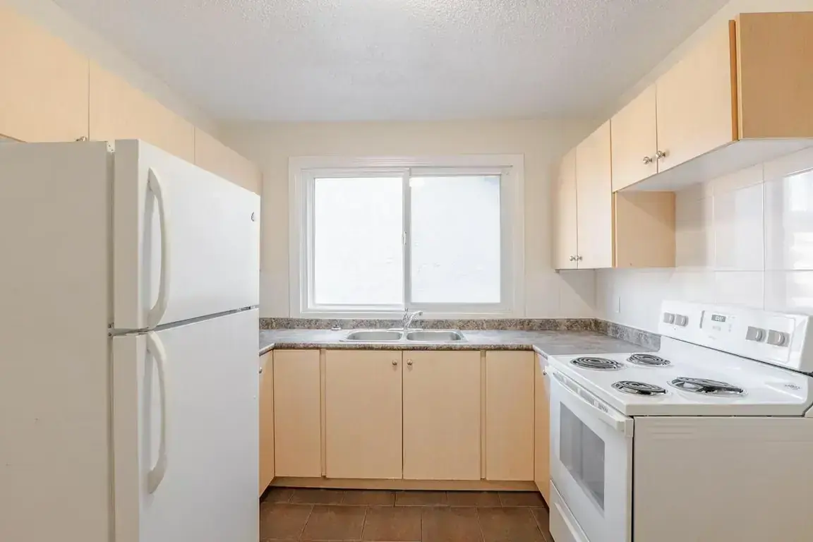Bright open-concept kitchen area at Steven Manor in Edmonton.