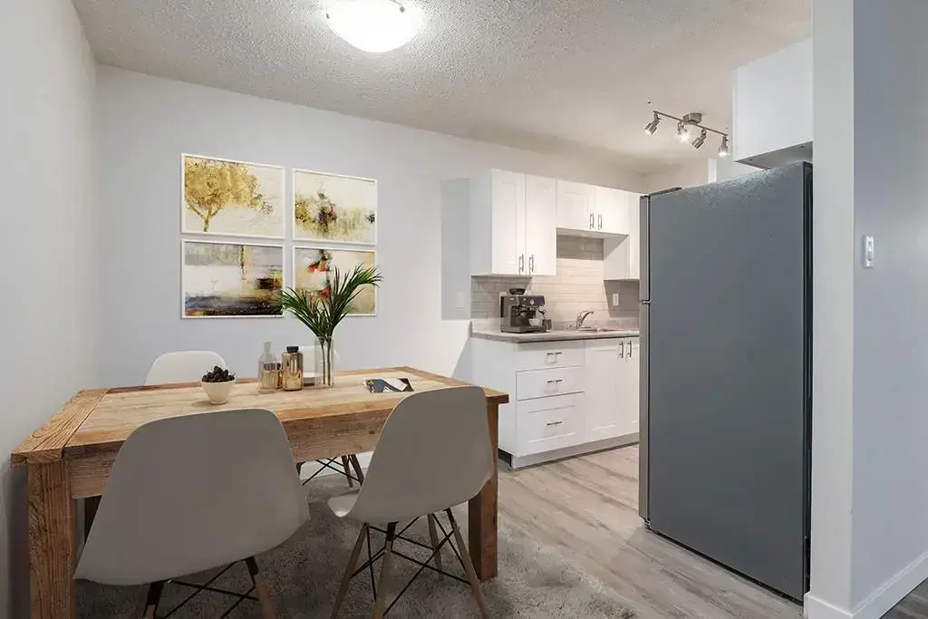 Dining area and kitchen at Camden Villa in Medicine Hat.