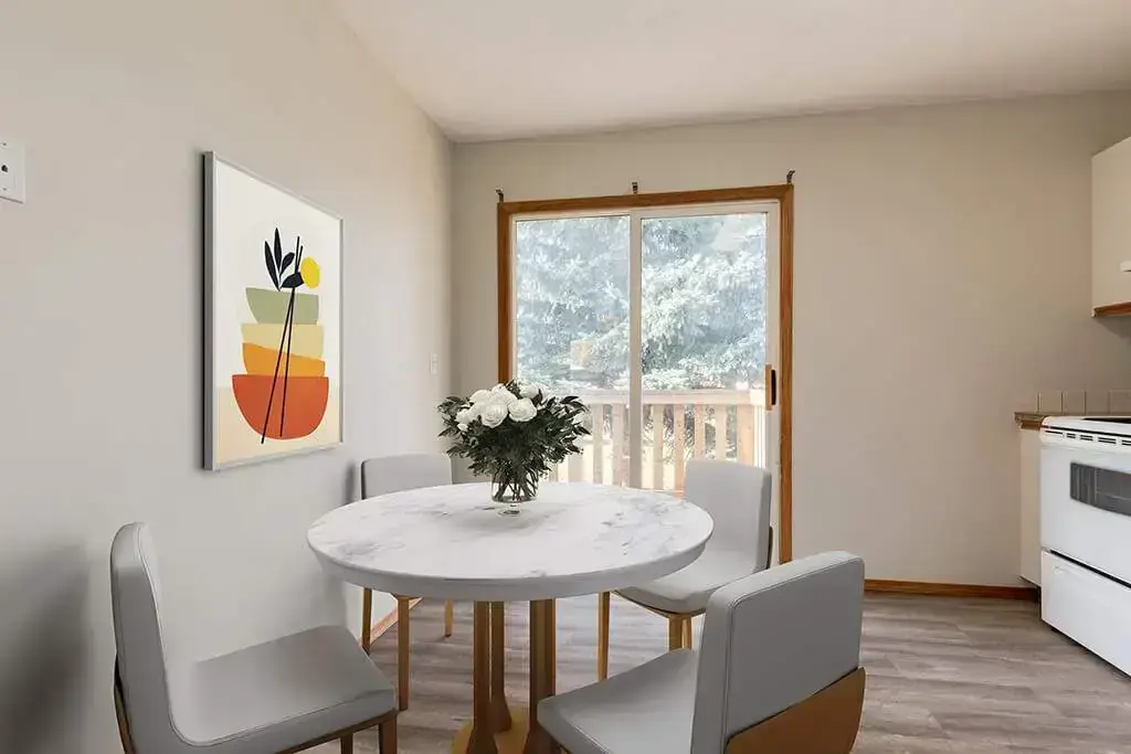 Dining area with natural light at Riverfront Estates in Red Deer.