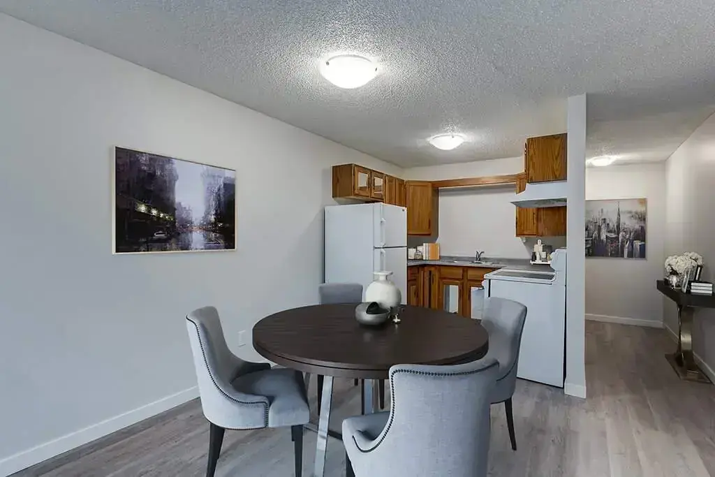 Dining area and open concept kitchen at Avenue Living apartments in Regina.