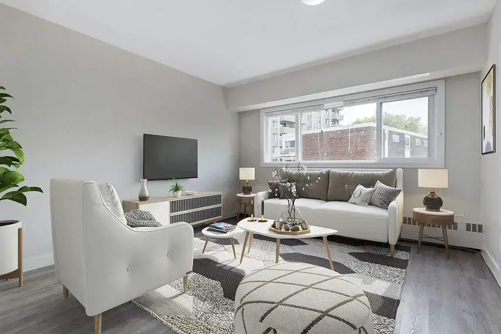 Living room filled with natural light at Crescent Towers in Saskatoon.
