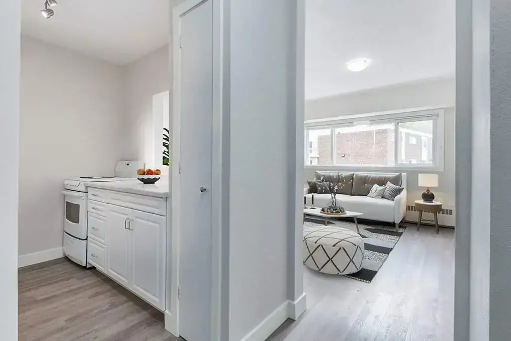 Open living room space  and kitchen at Crescent Towers in Saskatoon.