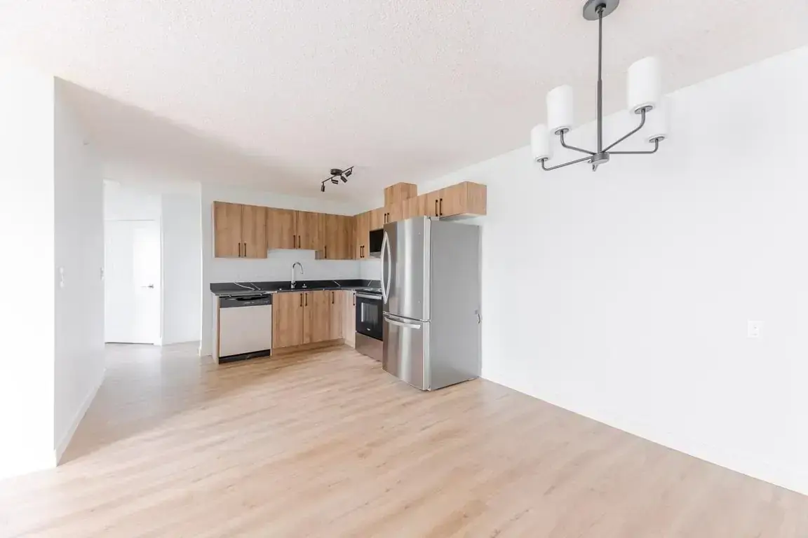 Bright open-concept kitchen area at Amberwynd Apartments.