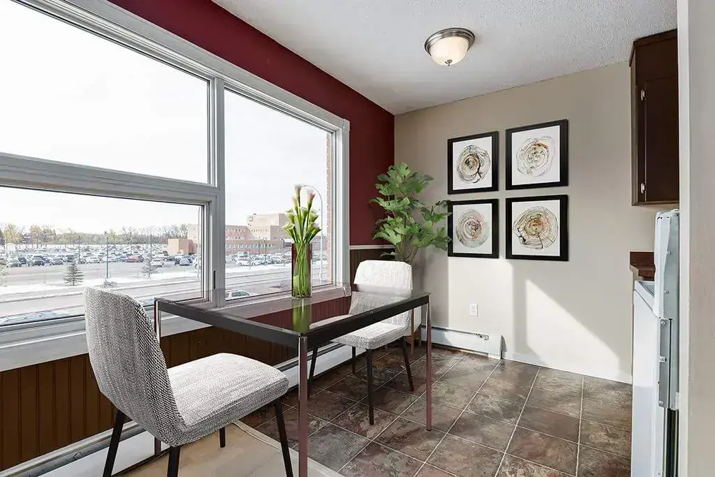 Bright dining area with large window at 233 Bradbrooke Drive, Yorkton.