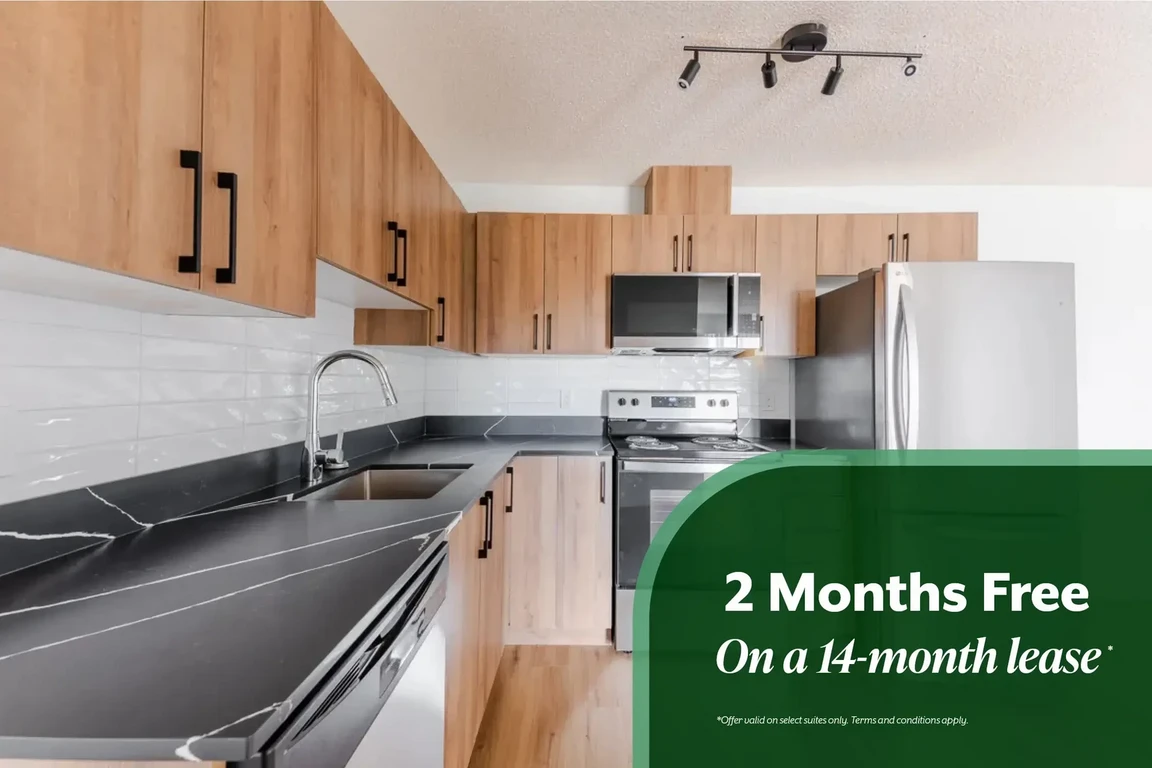 Open kitchen design connected to living space at Amberwynd Apartments in Spruce Grove.