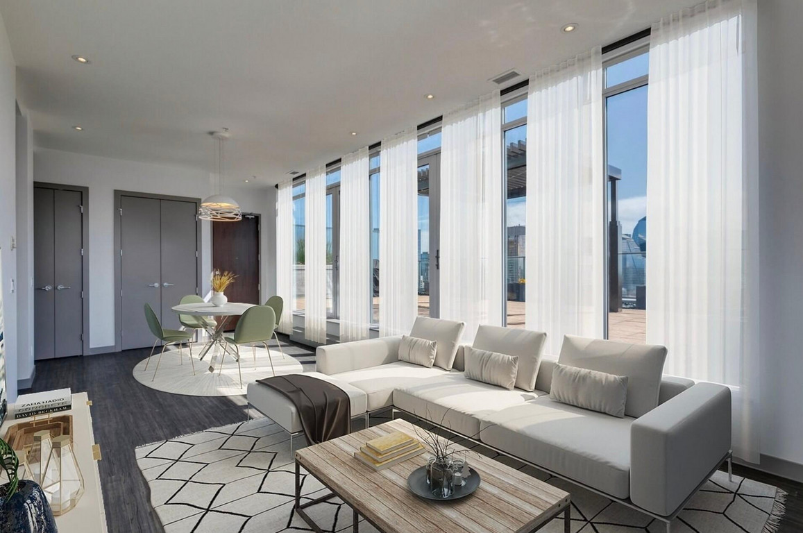 Large vertical windows in a clean 2 bedroom apartment.