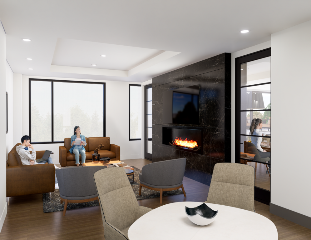 An upscale media lounge featuring a large flat-screen TV mounted on a floor-to-ceiling black marble fireplace wall with a glowing electric fire. Two residents are seated on cognac leather sofas—one using a laptop and one reading—while grey armchairs and a 