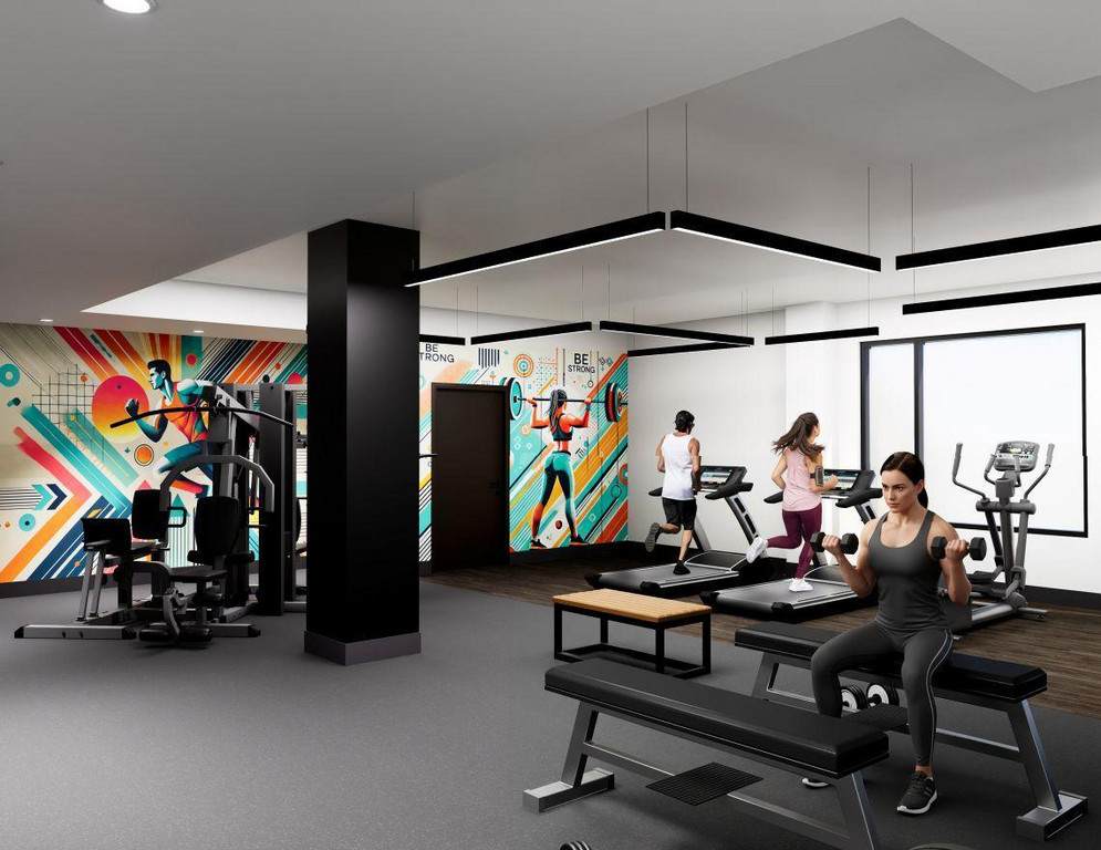 A bright, modern fitness center at The Vantage apartments featuring a woman seated on a weight bench lifting dumbbells. In the background, two people use treadmills and an elliptical. The gym features vibrant, colorful geometric wall murals of athletes, sl