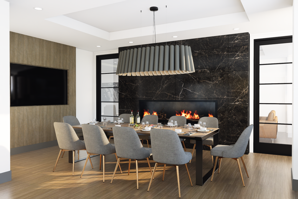 A sophisticated private dining suite at 200 Elgin St featuring a long wooden table set for a formal meal with eight grey upholstered chairs. The room is anchored by a black marble feature wall with a large built-in fireplace and a unique, oversized grey sc