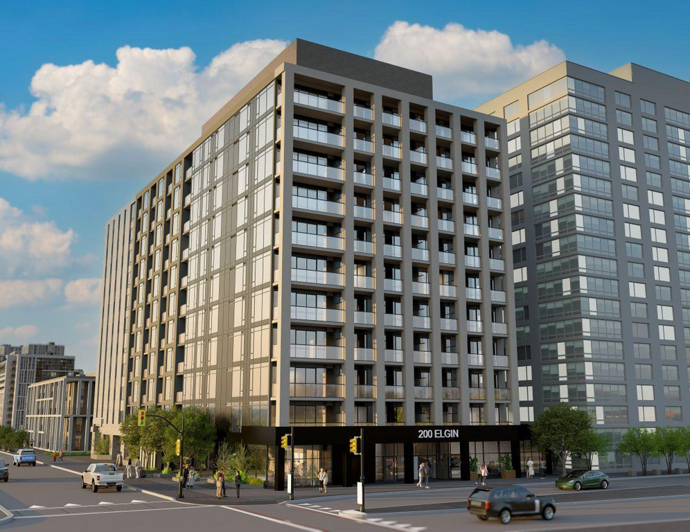 The exterior of The Vantage at 200 Elgin St, a modern high-rise apartment building in Centretown, Ottawa. The architecture features a sleek combination of red brick, dark grey metal accents, and expansive floor-to-ceiling glass windows. The building rises 