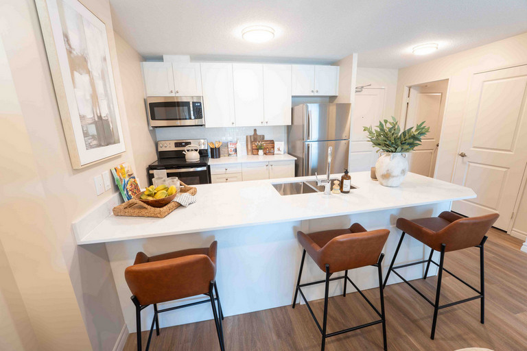 Kitchen with Quartz countertops and Stainless Steel Appliances at Edge
