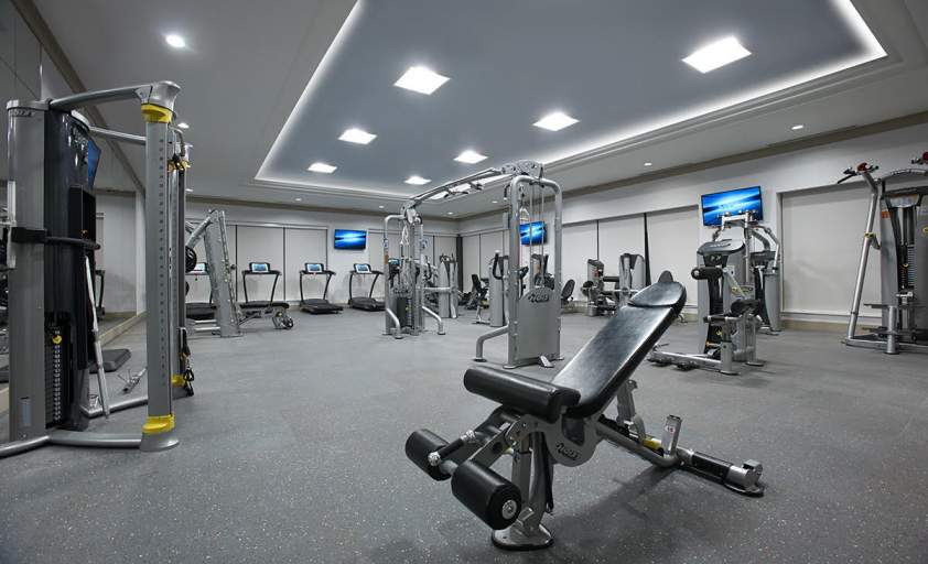 Fully equipped luxury fitness centre with cardio machines and full set of free weights and free wifi Midtown Toronto.